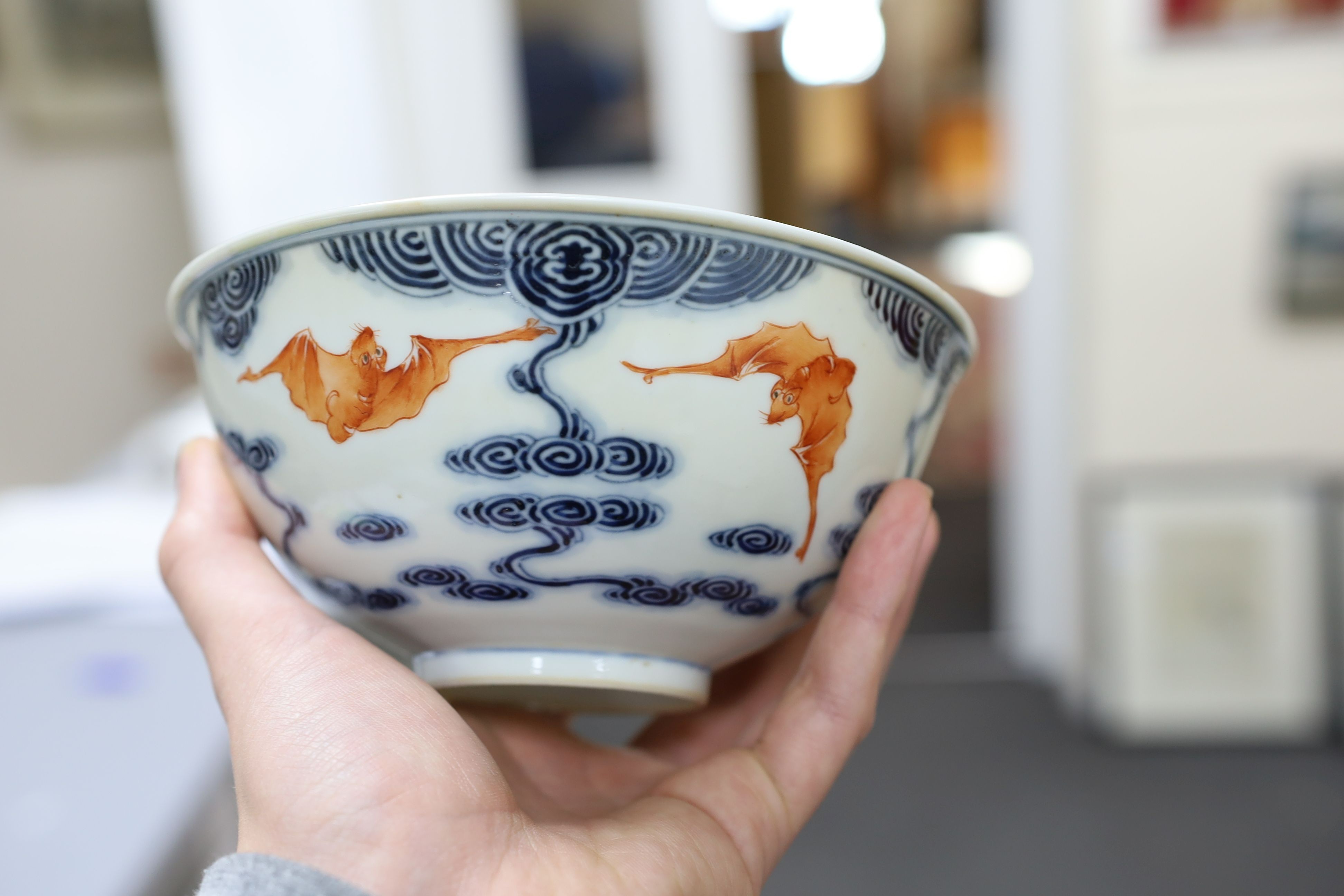 A pair of Chinese iron red and underglaze blue ‘five bat’ bowls, Guangxu mark and probably of the period (1875-1908), 16.5cm diameter